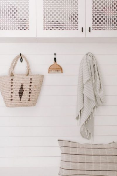 items hanging on wall hooks for simple living