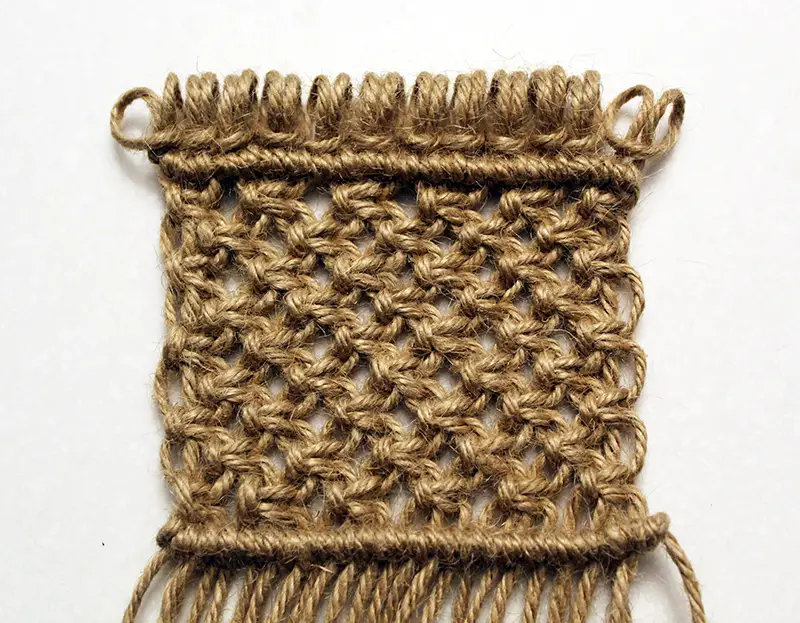 macrame pot scrubby with wooden dowel rod removed