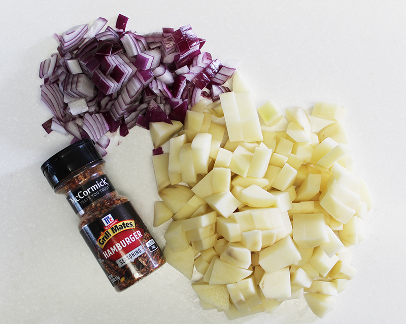 diced red onion, diced potatoes and bottle of McCormick's hamburger seasoning