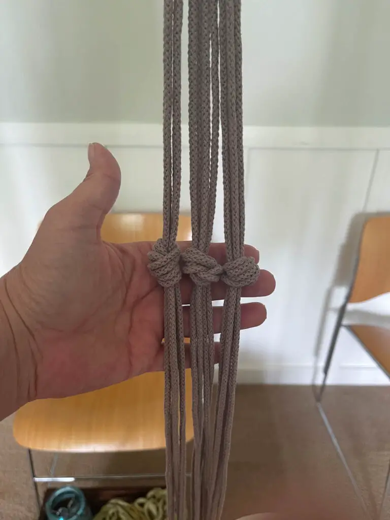 All three knots tied for first section of plant hanger